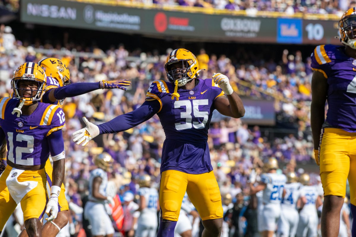 LSU football senior defensive end Sai&#8217;vion Jones (35) celebrates after recovering a fumble Saturday, Sept. 21, 2024, during LSU's 34-17 win against UCLA at Tiger Stadium in Baton Rouge, La.