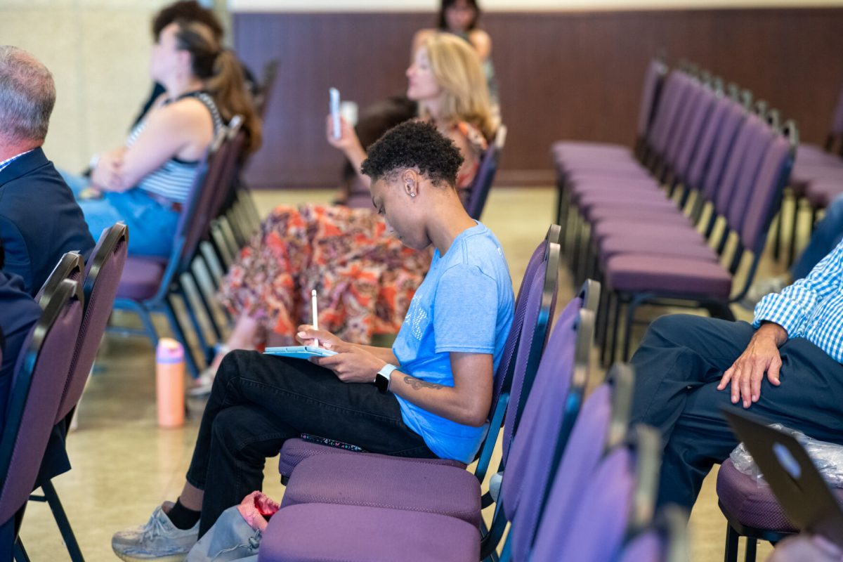 A member of the audience takes notes from the keynote speakers' speeches during the National Voter Registration Day Speaker Series hosted by Geaux Vote LSU on Tuesday, Sept. 17, 2024, inside the LSU Student Union at 310 LSU Student Union in Baton Rouge, La.