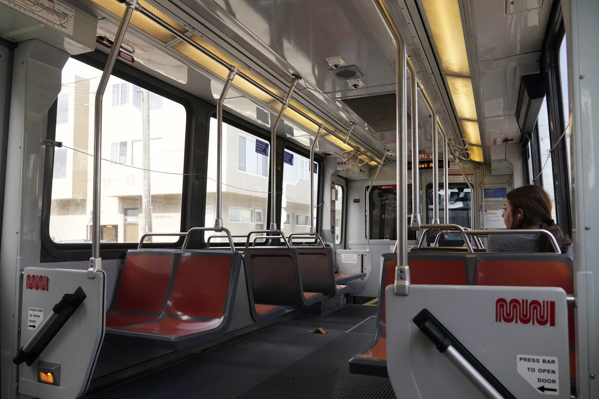 A passenger rides a mostly empty Muni streetcar in San Francisco, Tuesday, June 6, 2023. California's public transit agencies say they are running out of money, plagued by depleted ridership from the pandemic and soon-to-expire federal aid. But California's state government is having its own financial problems, leaving the fate of public transit agencies uncertain in this car-obsessed state.