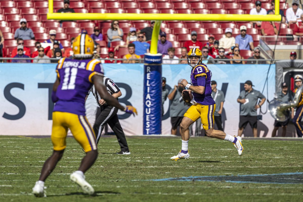 LSU football sophomore quarterback Garrett Nussmeier (13)eyes down junior wide receiver Brian Thomas Jr. (11)Monday, Jan. 1, 2024, during LSU's 35-31 win over Wisconsin at the Raymond James Stadium in Tampa, Fl.