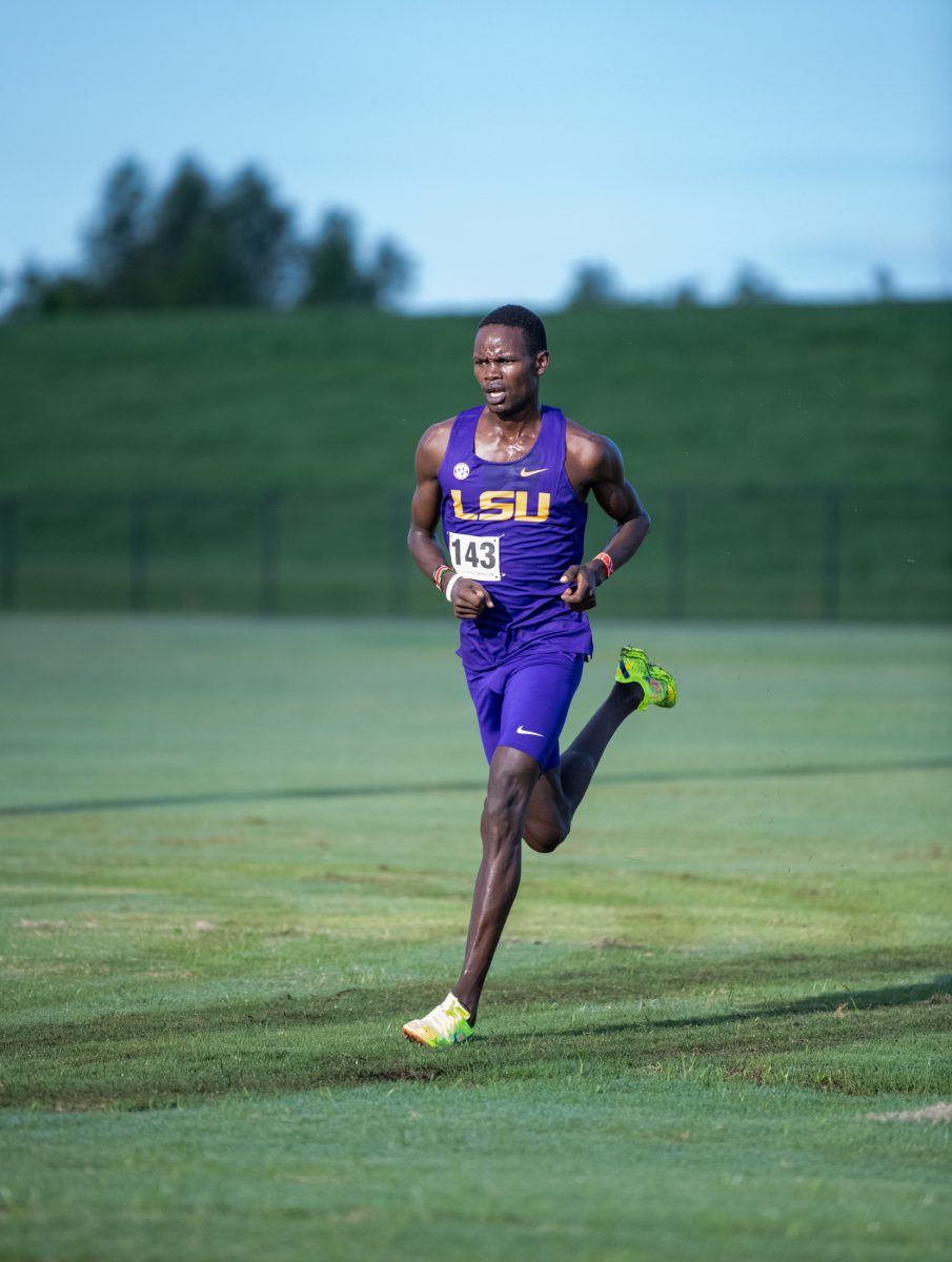 LSU men’s cross country freshman runner Emedy Kiplimo approaches the finish line in first on Friday, Sept. 13, 2024, during LSU’s 15-point win at the men’s LSU Cross Country Invitational at the LSU UREC Field Complex on Gourrier Avenue in Baton Rouge, La.