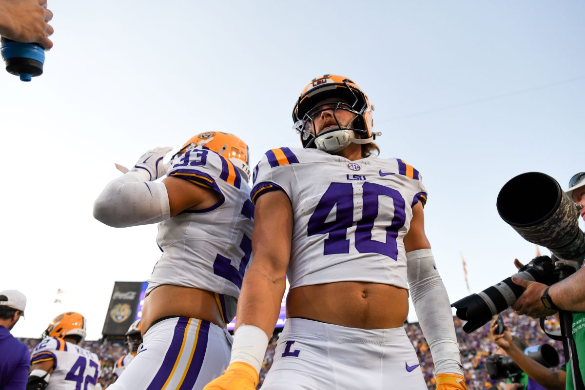 LSU football sophomore linebacker Whit Weeks (40) and senior linebacker West Weeks (33) stand side by side during warmups on Saturday, Sept. 28, 2024, before LSU's 42-10 win against South Alabama at Tiger Stadium in Baton Rouge, La.