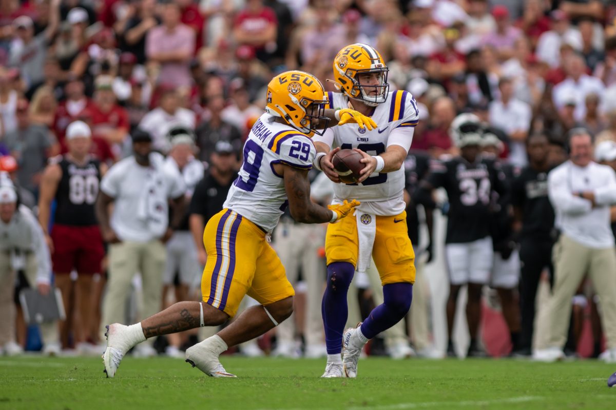 <p><span>LSU football freshman running back Caden Durham (29) takes the ball from redshirt junior Garrett Nussmeier (13) Saturday, Sept. 14th, 2024, during LSU’s 36-33 win over South Carolina at Williams-Brice Stadium in Columbia, Sc.</span></p>