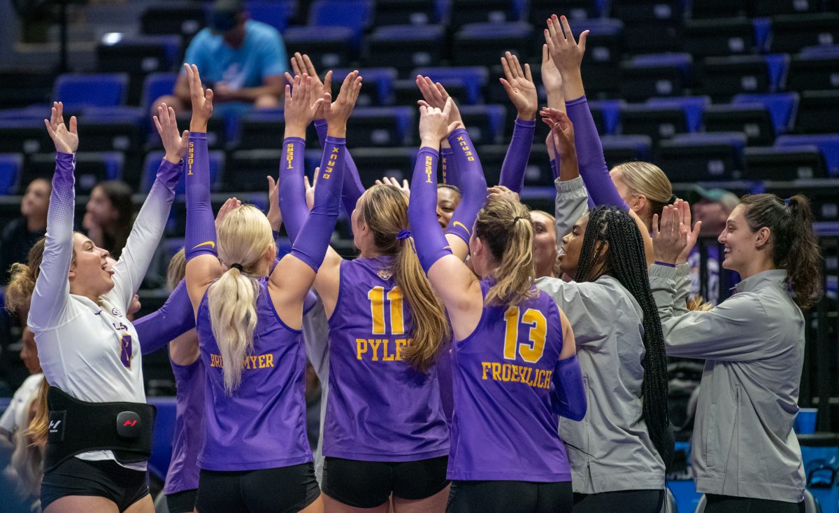 LSU volleyball players dance and clap during a break from play on Friday, Sept. 20, 2024, during LSU&#8217;s 3-0 loss to the San Diego in the Pete Maravich Assembly Center in Baton Rouge, La.