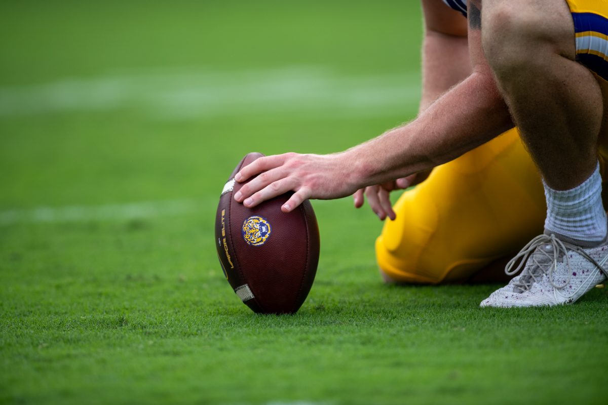 LSU football holder readies the ball for the kicker&#160;Saturday, Sept. 14th, 2024, during LSU&#8217;s 36-33 win over South Carolina at Williams-Brice Stadium in Columbia, South Carolina.