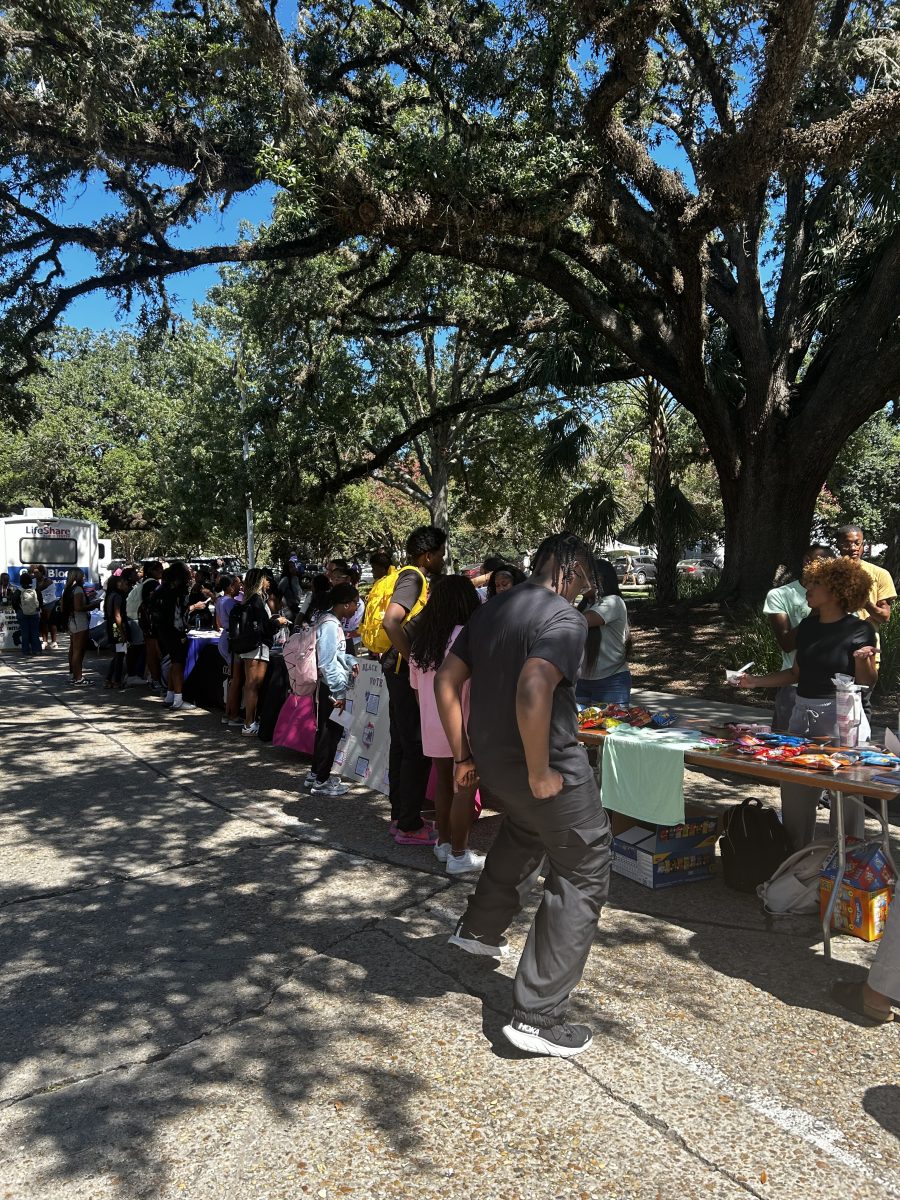 Students crowd around booths on Tower Drive at Dear Black LSU on Sept. 26, 2024.