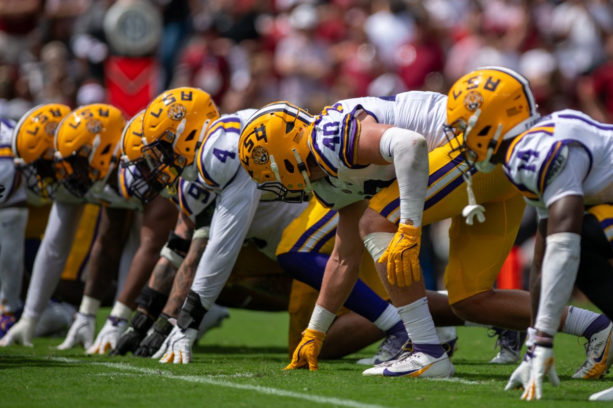 LSU football sophomore linebacker Whit Weeks (40), senior defensive end Bradyn Swinson (4), senior cornerback Zy Alexander (14), and the rest of the defensive line wait for the snap Saturday, Sept. 14th, 2024, during LSU&#8217;s 36-33 win over South Carolina at Williams-Brice Stadium in Columbia, Sc.