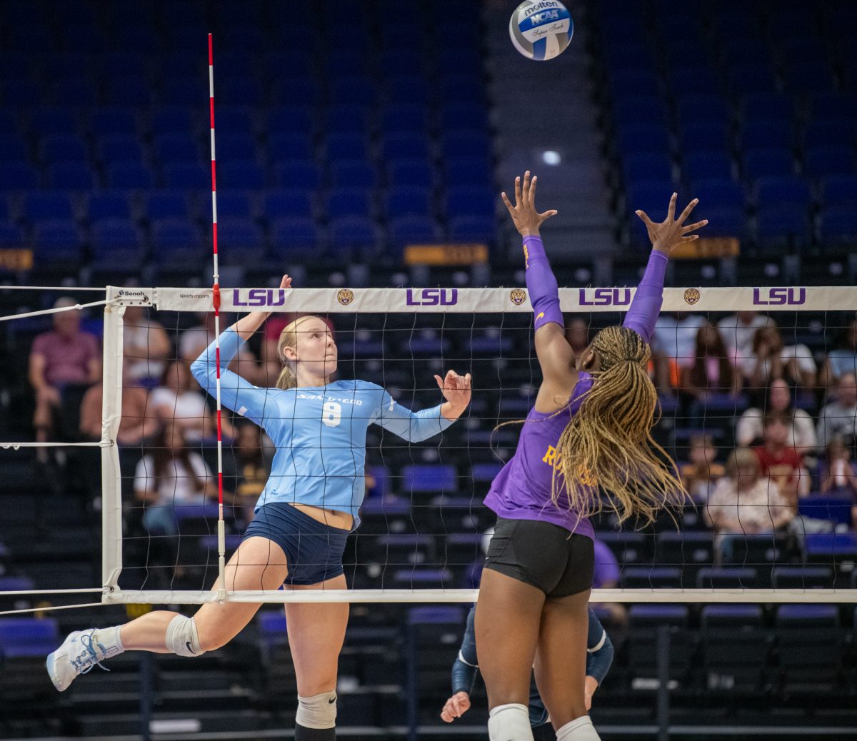 LSU volleyball outside hitter sophomore Jurnee Robinson (5) attempts to block a hit by San Diego Friday, Sept. 20, 2024, during LSU&#8217;s 3-0 loss to the San Diego in the Pete Maravich Assembly Center in Baton Rouge, La.