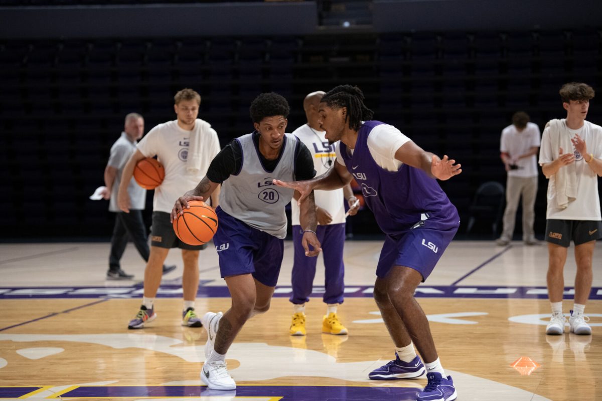 LSU men&#8217;s basketball 5th-year-senior forward Derek Fountain (20) and junior forward Noah Boyde (7) run a drill Wednesday, Sept. 25, 2024, during the team's open practice at the Pete Maravich Assembly Center in Baton Rouge, La.