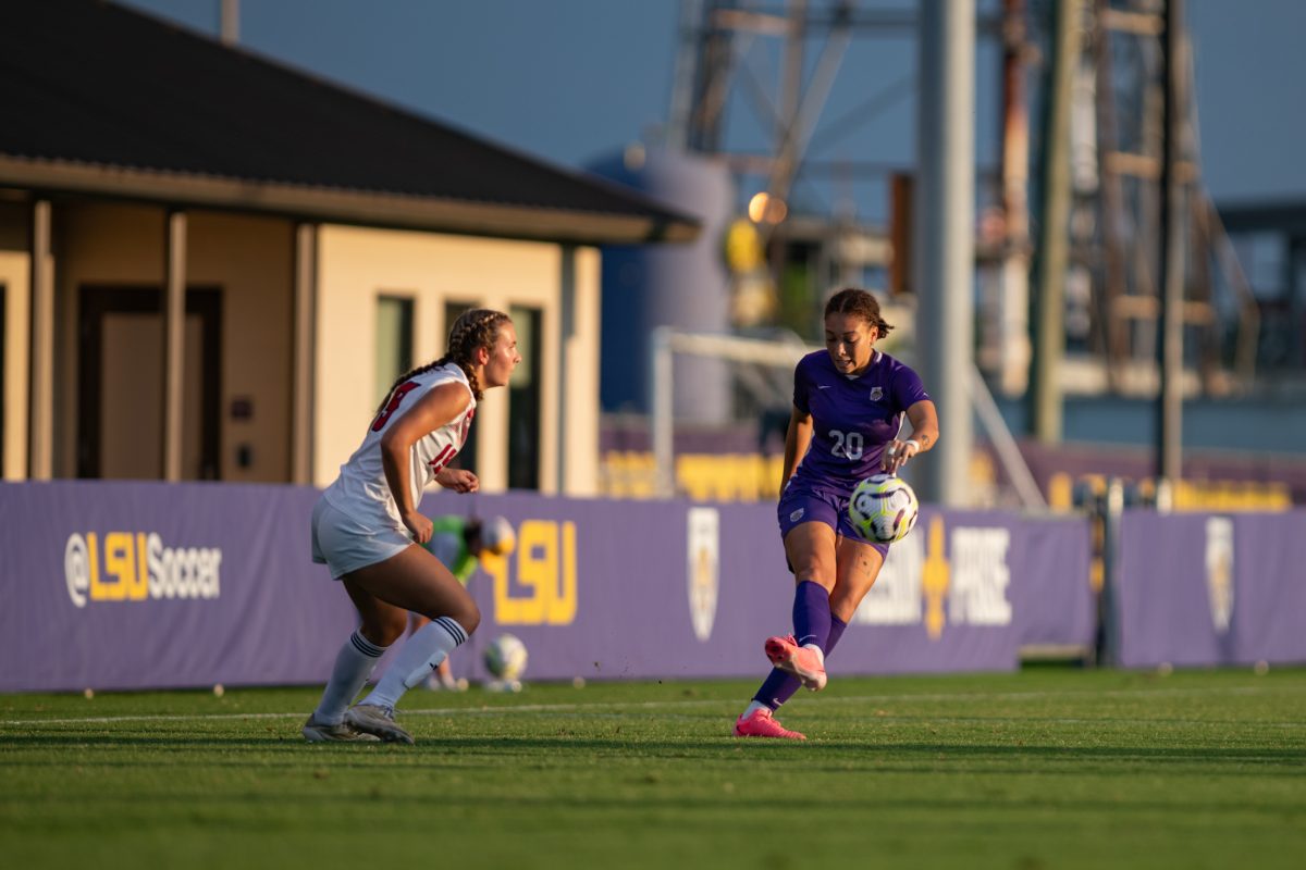 LSU soccer sophomore forward/midfielder Ava Galligan (20) kicks the ball away from her opponent Sunday, Sept. 8, 2024, during LSU's 3-1 win against ULL at the LSU Soccer Stadium in Baton Rouge, La.