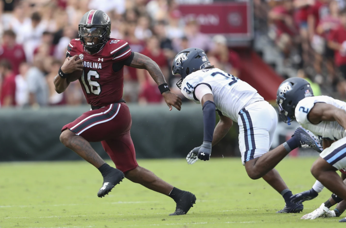 South Carolina quarterback LaNorris Sellers (16) runs away from Old Dominion linebacker Jahleel Culbreath (34) during the first half of an NCAA college football game Saturday, Aug. 31, 2024, in Columbia, S.C.