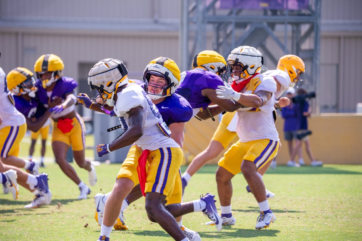 LSU football sophomore linebacker Whit Weeks (40) pushes redshirt freshman wide receiver Isaiah Stone (80) during the LSU Fall Camp practice on Saturday, Aug. 17, 2024, in Baton Rouge.