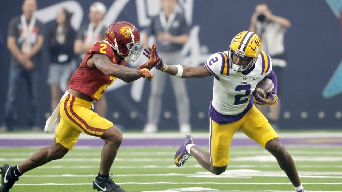 LSU wide receiver Kyren Lacy, right, tries to fend off a tackle by Southern California cornerback Jaylin Smith, left, during the first half of an NCAA college football game Sunday, Sept. 1, 2024, in Las Vegas.