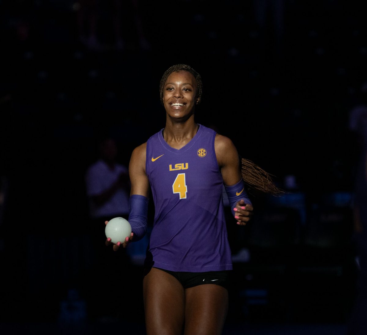 LSU volleyball middle blocker sophomore Angelina Lee (4) prepares to throw merch to the crowd Friday, Sept. 20, 2024, during LSU’s 3-0 loss to the San Diego in the Pete Maravich Assembly Center in Baton Rouge, La.