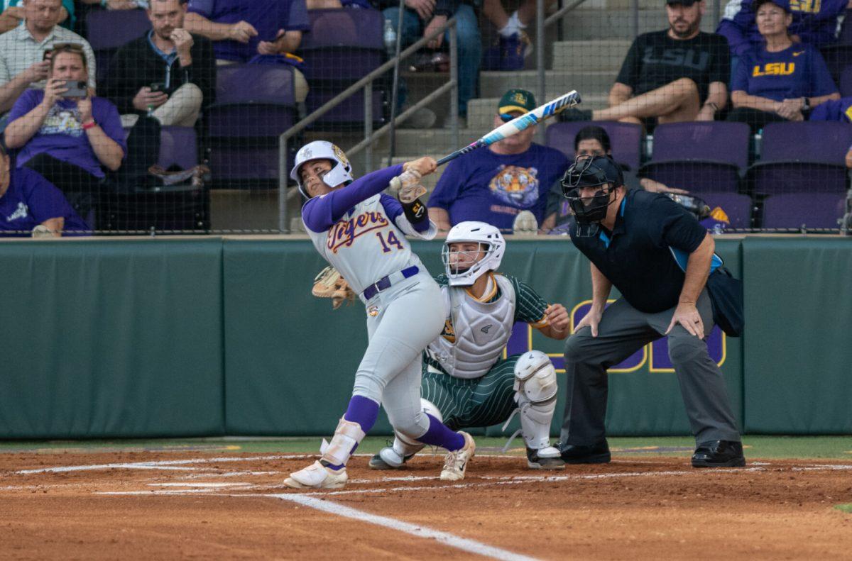 LSU softball junior outfield Jalia Lassiter (14) swings Wednesday, Oct. 23, 2024, during LSU's exhibition game against Southeastern at Tiger Park in Baton Rouge, La.