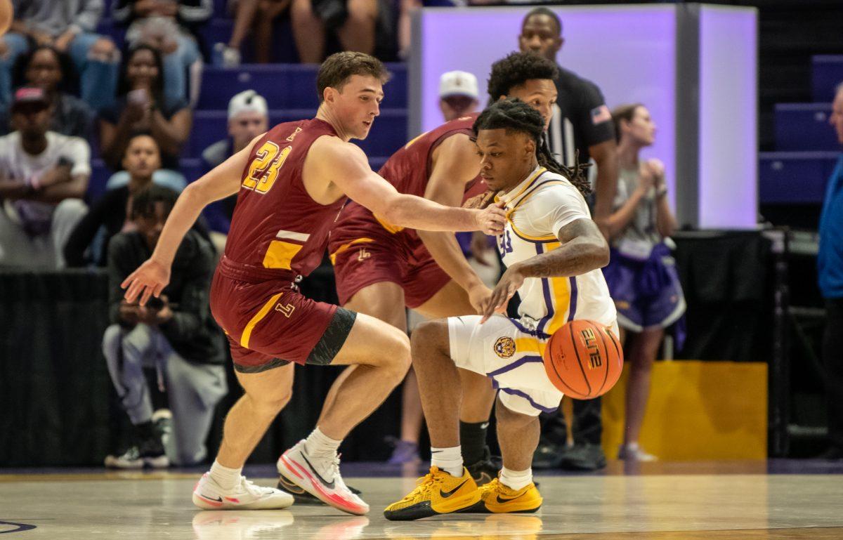 LSU men's basketball 5th-year-senior guard Jordan Sears (1) loses control of the ball during LSU's 110-48 exhibition win against Loyola on Tuesday, Oct. 29, 2024, in the Pete Maravich Assembly Center in Baton Rouge, La.