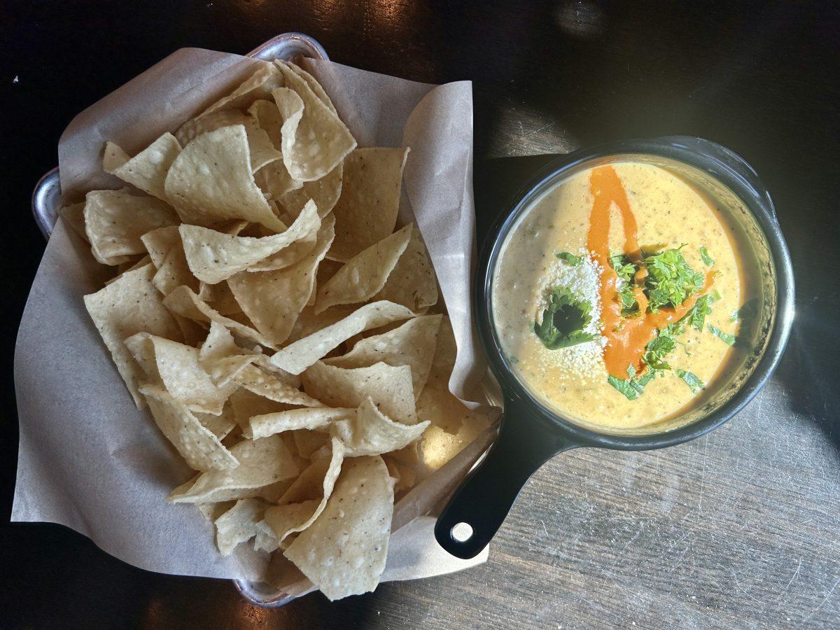 Torchy's Tacos famous green chile queso and chips.&#160;