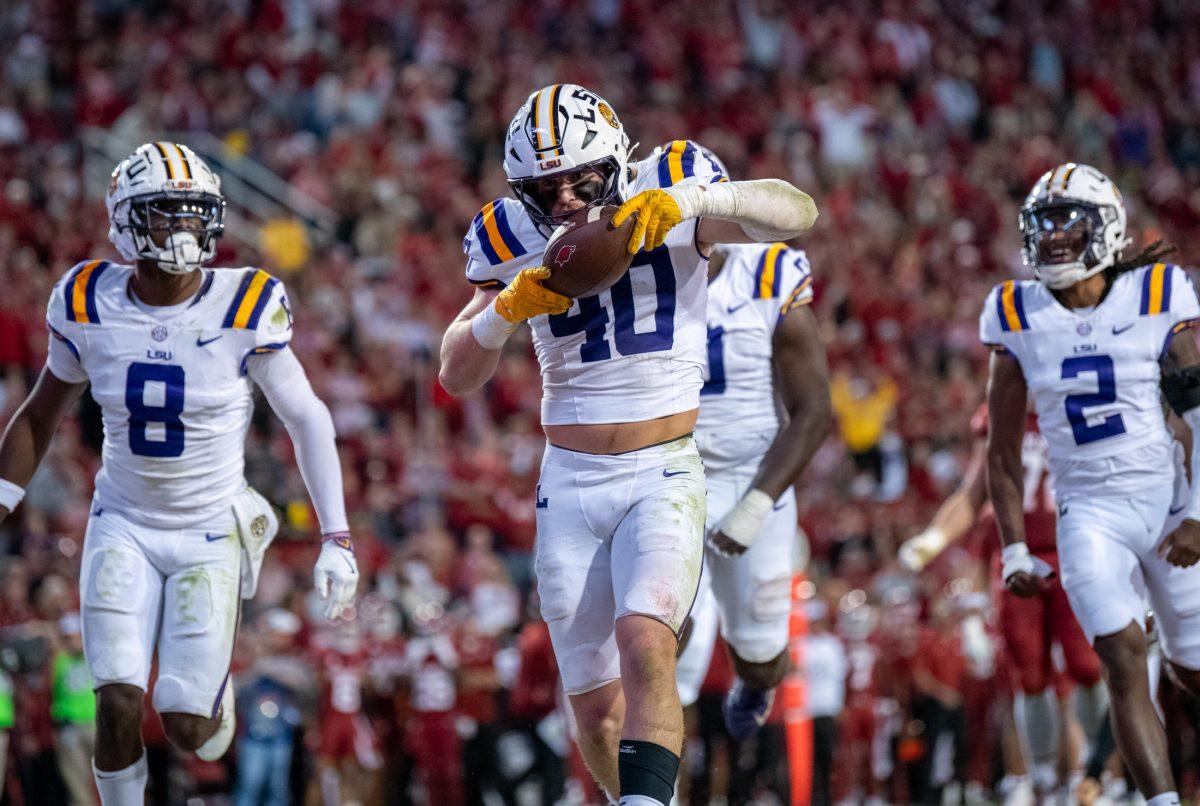 LSU football sophomore linebacker Whit Weeks (40) celebrates after an interception Saturday, Oct. 19, 2024, during LSU&#8217;s 34-10 win against Arkansas at Donald W. Reynolds Razorback Stadium on North Razorback Road in Fayetteville, Ar.