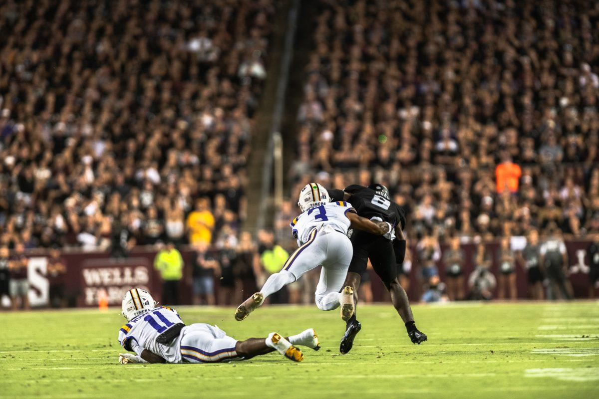 Freshman cornerback PJ Woodland (11) and redshirt junior safety Sage Ryan (3) rush to tackle a Texas A&amp;M player on Saturday, Oct. 26, 2024, during LSU's 23-38 loss against Texas A&amp;M at Kyle Field in College Station, Texas.&#160;