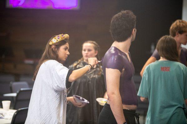 LSU cognitive neuroscience and criminology sophomore Emily Thornton paints the base of a member of the Painted Posse Saturday, Sept. 21, 2024, at the LSU Baptist Collegiate Ministry on Highland Road in Baton Rouge, La.