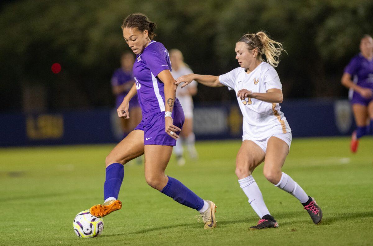 LSU soccer sophomore forward/midfielder Ava Galligan (20) evades a Vanderbilt player Thursday, Oct. 24, 2024, during LSU’s 0-0 tie against Vanderbilt at the LSU Soccer Stadium in Baton Rouge, La.