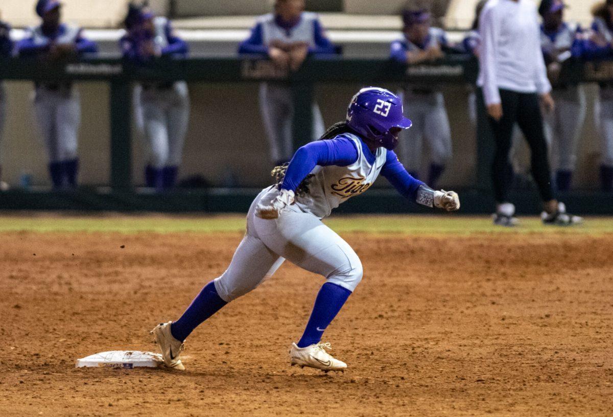 LSU softball sophomore utility Savanna Bedell (16) runs to third base Wednesday, Oct. 23, 2024, during LSU's exhibition game against Southeastern at Tiger Park in Baton Rouge, La.