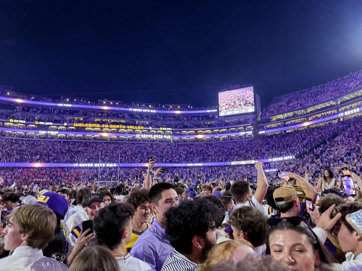 Fans stand shoulder to shoulder on Tiger Stadium after rushing the field on Oct. 13, 2024.