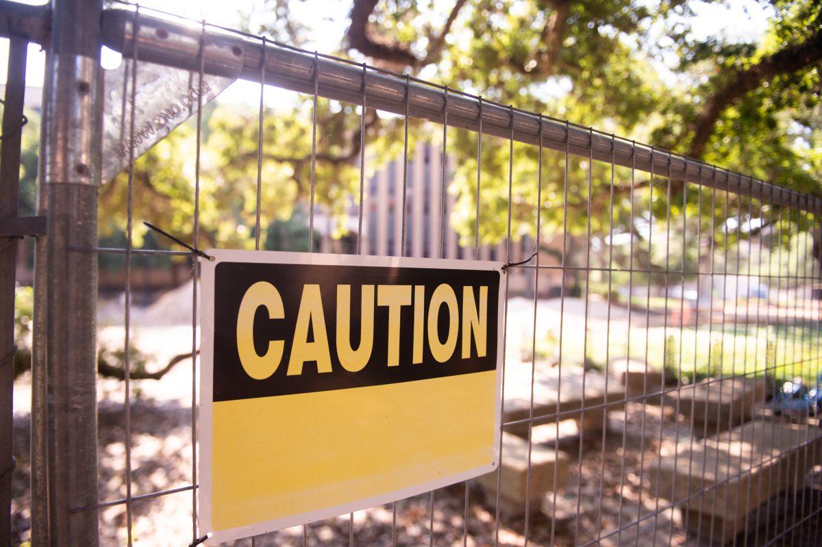 Caution sign on fencing around construction Wednesday, June 12, 2024, on Field House Drive on LSU's campus in Baton Rouge, La.