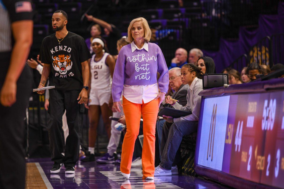 LSU women's basketball head coach Kim Mulkey sports a vibrant outfit as she coaches during LSU's 114-53 win against Xavier on Thursday, Oct. 24, 2024, in the Pete Maravich Assembly Center in Baton Rouge, La.