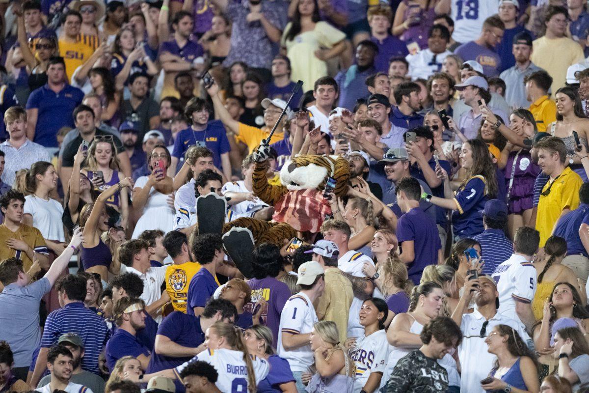 Mike the Tiger crowd surfs in the student section Saturday, Sept. 23, 2023, during LSU's 34-31 win against Arkansas at Tiger Stadium in Baton Rouge, La.