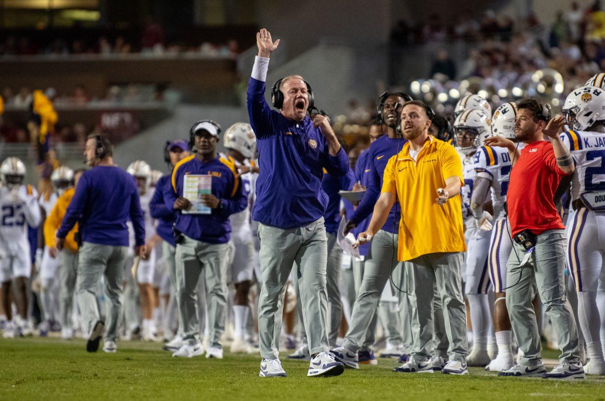 LSU football head coach Brian Kelley yells on the sideline Saturday, Oct. 19, 2024, during LSU&#8217;s 34-10 win against Arkansas at Donald W. Reynolds Razorback Stadium on North Razorback Road in Fayetteville, Ar.