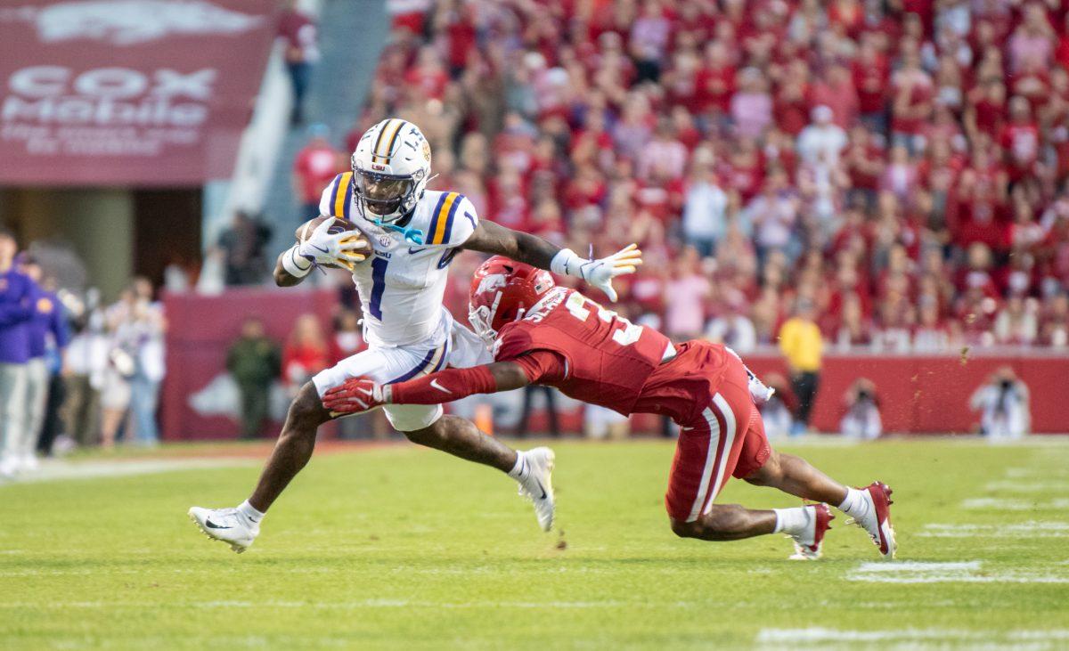 LSU football redshirt sophomore wide receiver Aaron Anderson (1) evades an Arkansas player Saturday, Oct. 19, 2024, during LSU's 34-10 win against Arkansas at Donald W. Reynolds Razorback Stadium on North Razorback Road in Fayetteville, Ar.