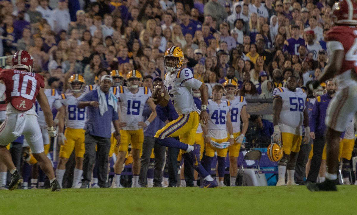 LSU football junior quarterback Jayden Daniels (5) scrambles down the field on Saturday, Nov. 5, 2022, during LSU&#8217;s 32-31 victory over Alabama in Tiger Stadium in Baton Rouge, La.