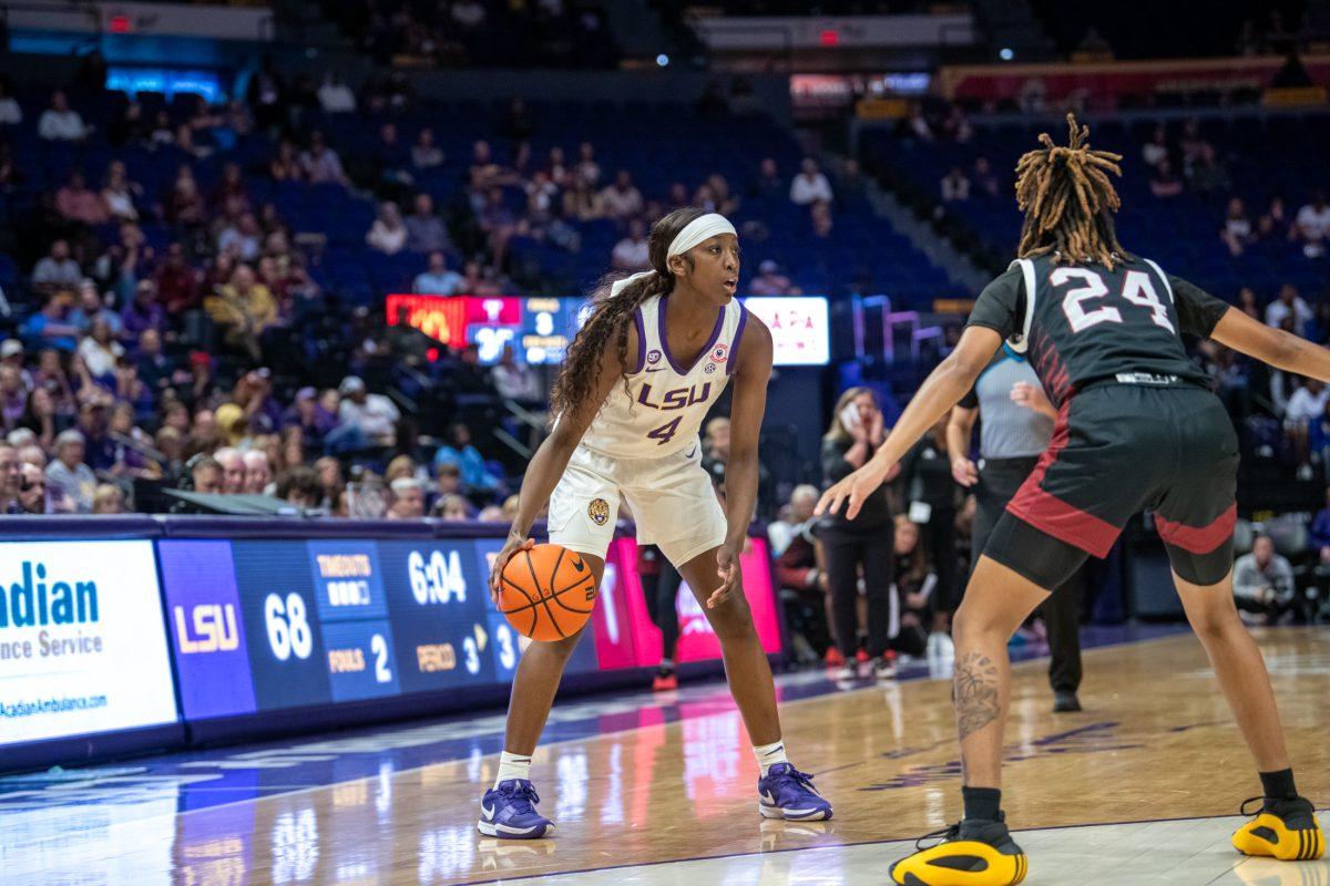 LSU women&#8217;s basketball junior guard Flau&#8217;Jae Johnson (4) looks for an open pass during LSU's 98-59 win against Troy on Monday, Nov. 18, 2024, in the Pete Maravich Assembly Center in Baton Rouge, La.