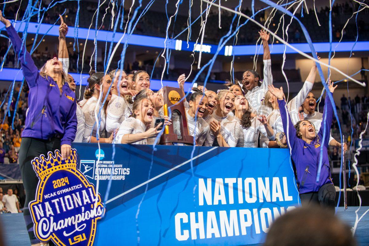 The LSU gymnastics team cheers as confetti falls following LSU's NCAA Championship win on Saturday, April 20, 2024, in Fort Worth, Tx.