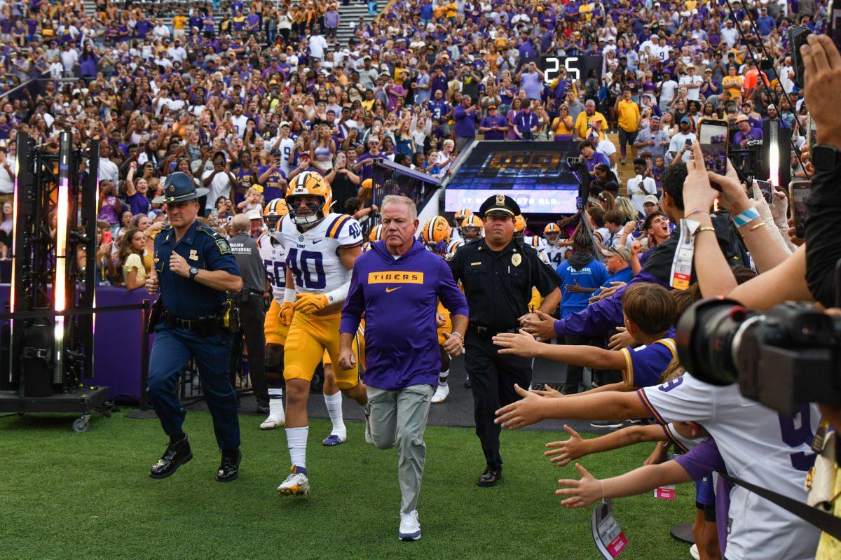 LSU football head coach Brian Kelly runs out with the team on Saturday, Sept. 7, 2024, before LSU’s 44-21 win against Nicholls at Tiger Stadium in Baton Rouge, La.