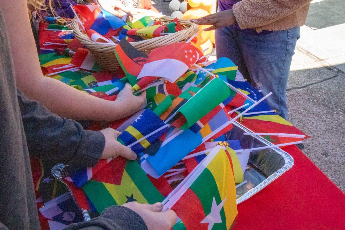 Students take their national flag Thursday, Nov. 21, 2024, on Tower Drive in Baton Rouge, La.