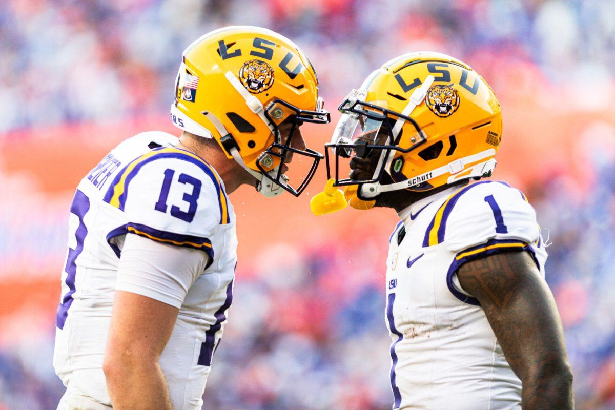 LSU football redshirt sophomore Aaron Anderson (1) and redshirt junior quarterback Garrett Nussmeier (13) celebrating LSU's first touchdown of the game on Saturday, Nov. 16, 2024, at Ben Hill Griffin Stadium in Gainesville, Fl. 