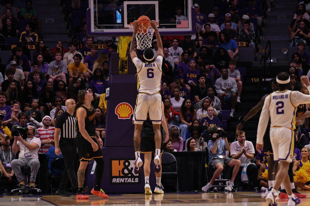 LSU men's basketball freshman forward Robert Miller III (6) dunks the ball during their season opening 95-60 win against University of Louisiana at Monroe on Wednesday, Nov. 6, 2024, in the Pete Maravich Assembly Center in Baton Rouge, La.