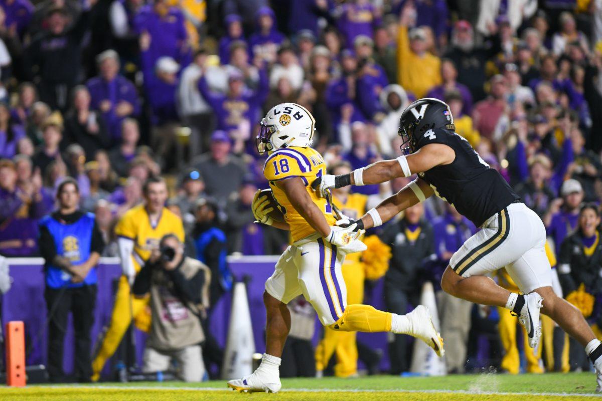 LSU football graduate student running back Josh Williams (18) scores the first Tigers touchdown of the game against Vanderbilt on Nov. 23, 2024, in Tiger Stadium in Baton Rouge, La.