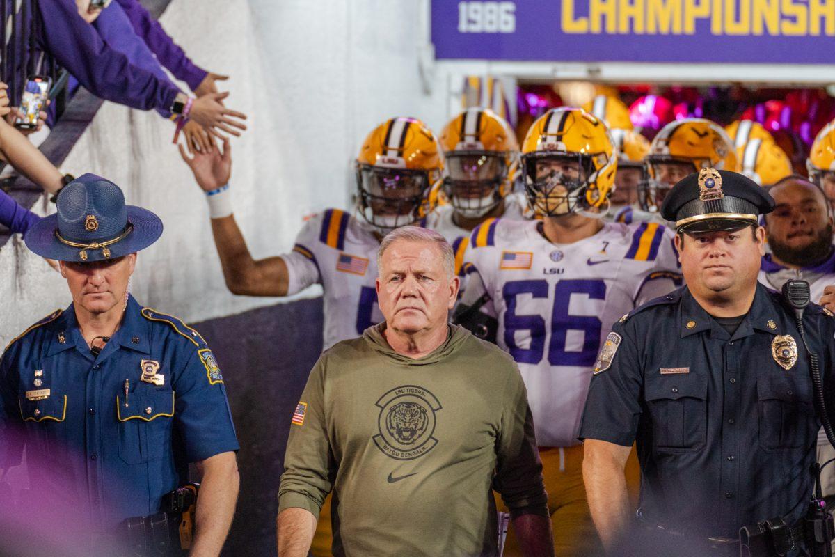 LSU football head coach Brian Kelly leads the team out onto the field Saturday, Nov. 11, 2023, before LSU's 52-35 win against Florida in Tiger Stadium in Baton Rouge, La.