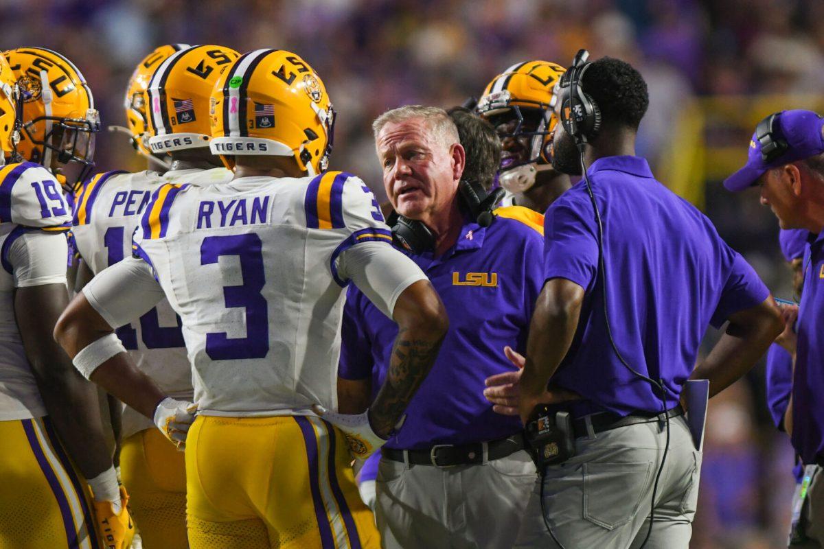 LSU football head coach Brian Kelly talks to his starting lineup during a timeout in LSU's 29-26 win against Ole Miss in Tiger Stadium on Saturday, Oct. 12, 2024, in Baton Rouge, La.