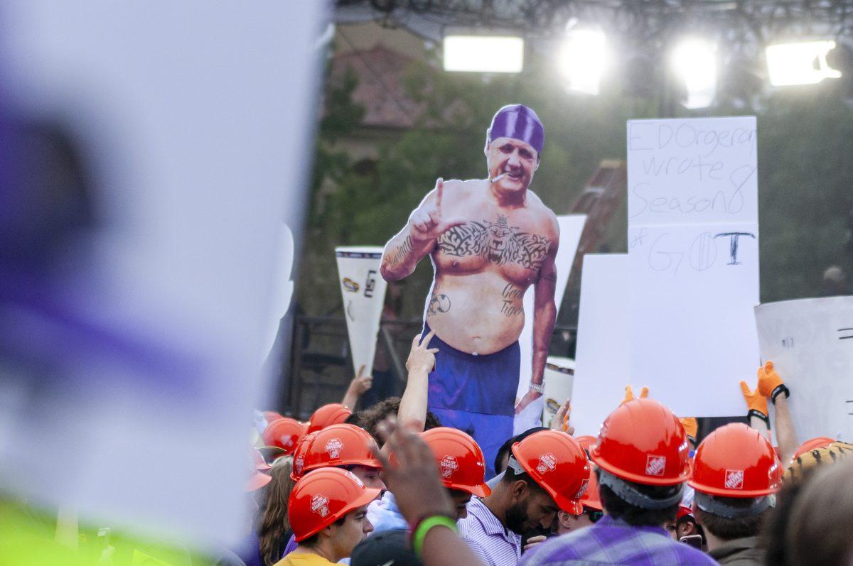 LSU Tiger fans hold up signs during the College Gameday broadcast from LSU's campus on Saturday, Oct. 12, 2019.