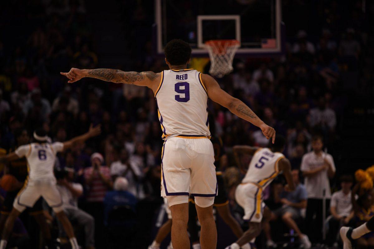 LSU men's basketball junior forward Jalen Reed (9) points to signal to a teammate during their season opening 95-60 win against University of Louisiana at Monroe on Wednesday, Nov. 6, 2024, in the Pete Maravich Assembly Center in Baton Rouge, La.