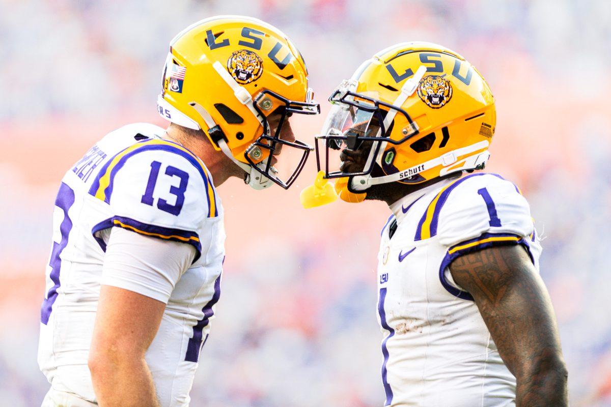 LSU football redshirt sophomore wide receiver Aaron Anderson (1) and redshirt junior quarterback&#160;Garrett Nussmeier (13) celebrating LSU's first touchdown of the game during&#160;LSU's 16-27 loss against the University of Florida on Saturday, Nov. 16, 2024, at Ben Hill Griffin Stadium in Gainesville, Fl.&#160;