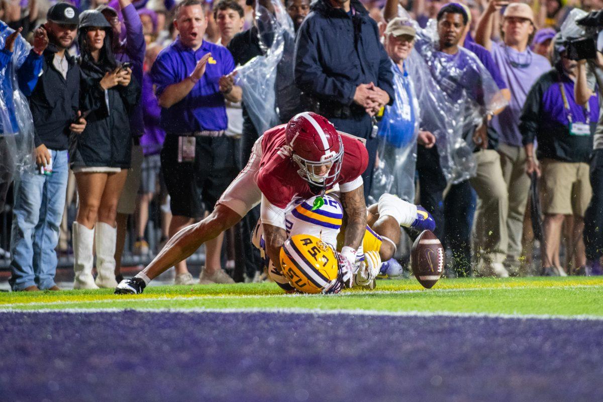 LSU football freshman running back Caden Durham (29) gets tackled by Alabama's defense Saturday, Nov. 9, 2024, during LSU's 42-13 loss to Alabama at Tiger Stadium in Baton Rouge, La.