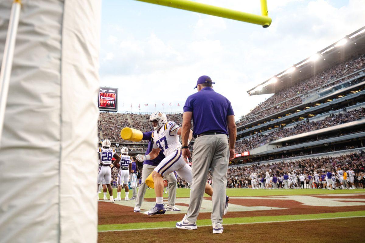 LSU football redshirt freshman defensive end Dylan Carpenter (97) warms up on Saturday, Oct. 26, 2024, before LSU's 23-38 loss against Texas A&M at Kyle Field in College Station, Texas. 