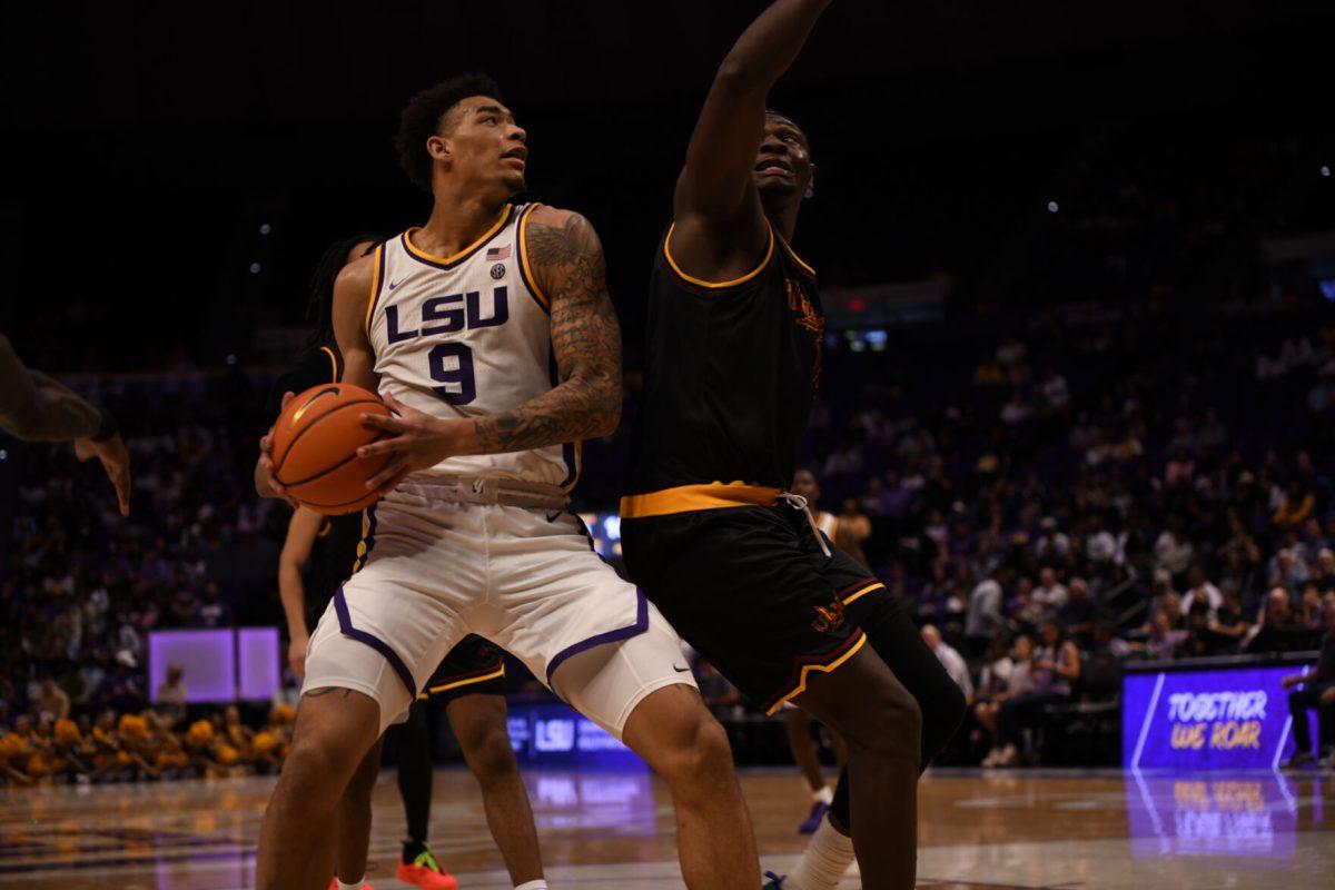 LSU men's basketball junior forward Jalen Reed (9) prepares to shoot the ball during LSU's season opening 95-60 win against University of Louisiana at Monroe on Wednesday, Nov. 6, 2024 in the Pete Maravich Assembly Center in Baton Rouge, La.