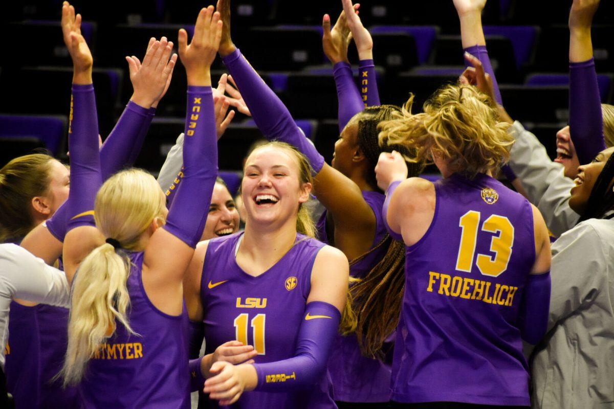 LSU volleyball players hype each other up during a timeout in their match against San Diego, Saturday, Sept. 21, 2024, at the Pete Maravich Assembly Center in Baton Rouge, La.