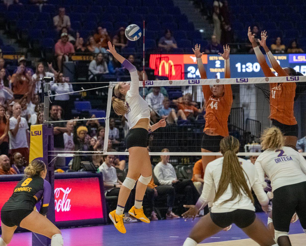 LSU volleyball freshman outside hitter Lainee Pyles (11) hits the ball over the net Sunday, Sept. 29, 2024, during LSU&#8217;s 3-0 loss against Texas in the Pete Maravich Assembly Center in Baton Rouge, La.